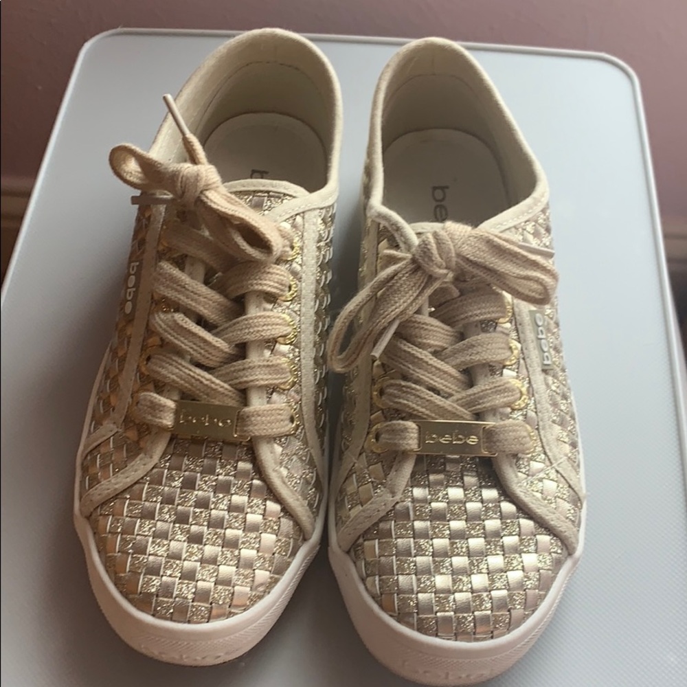 Bebe gold sneakers.